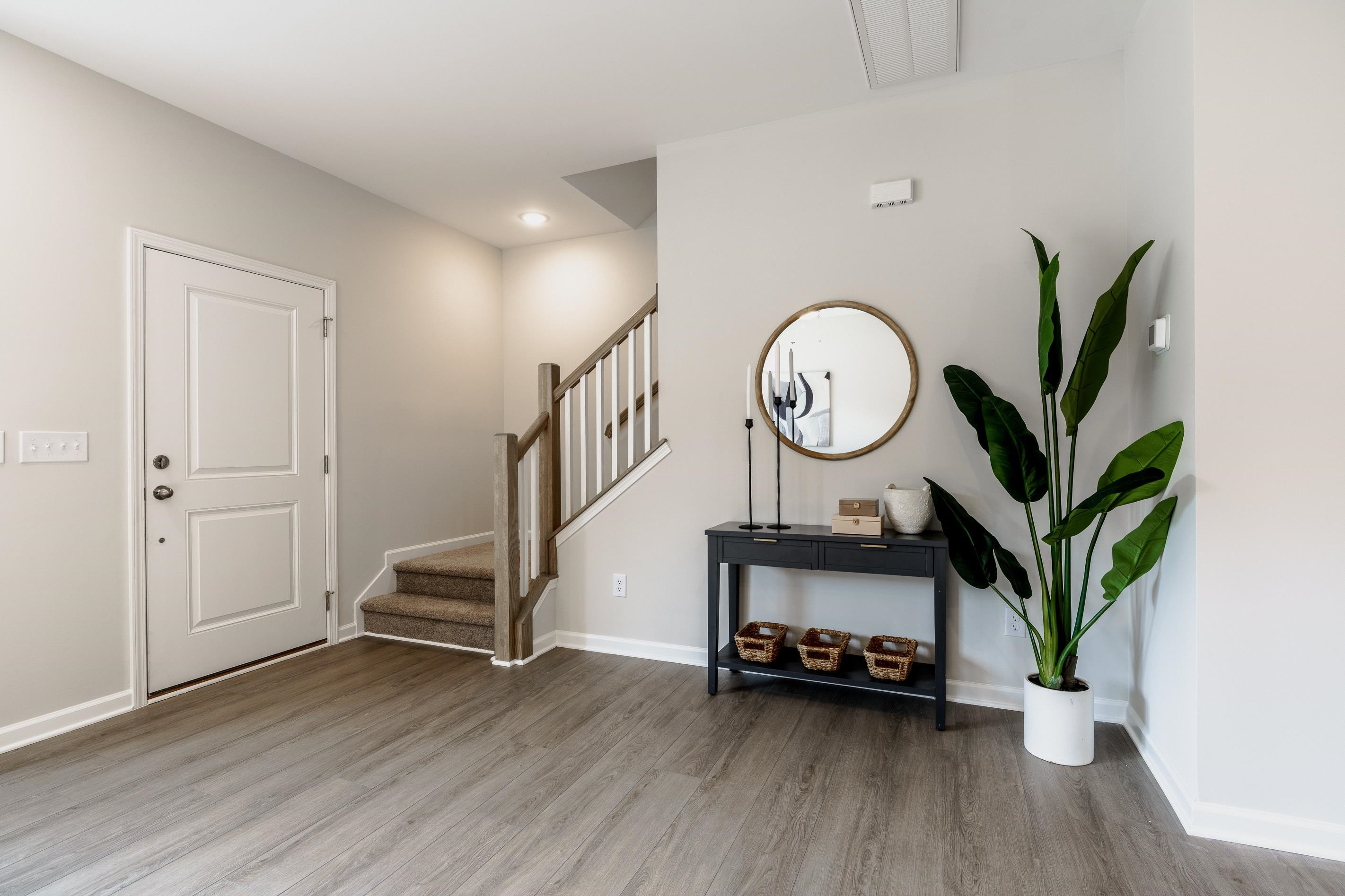 1309 Swingline Way Raleigh, NC 27610 - Photo 26 of 47 a view of a room with wooden floor and a potted plant