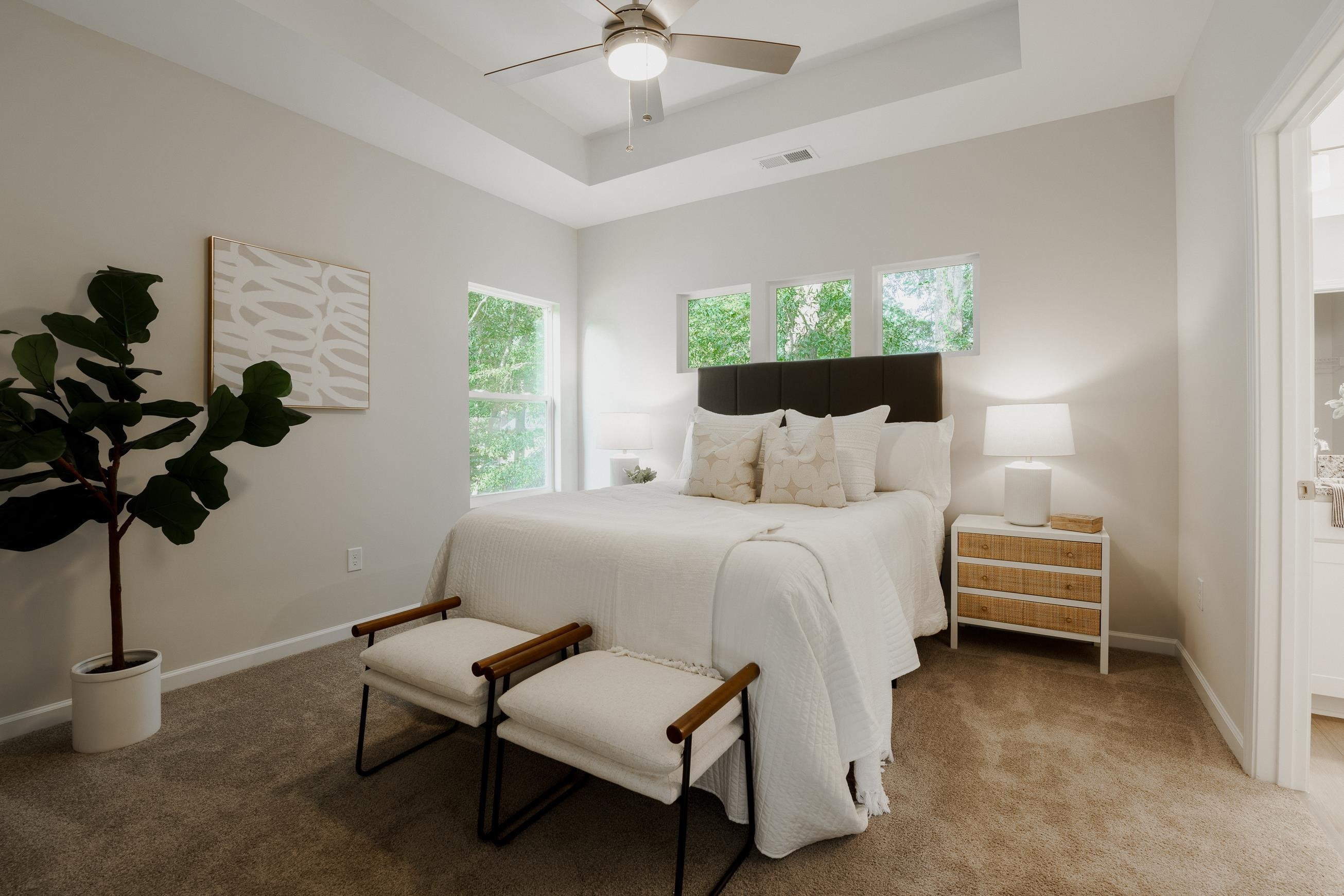 1309 Swingline Way Raleigh, NC 27610 - Photo 27 of 47 a bedroom with a bed a chandelier and a window