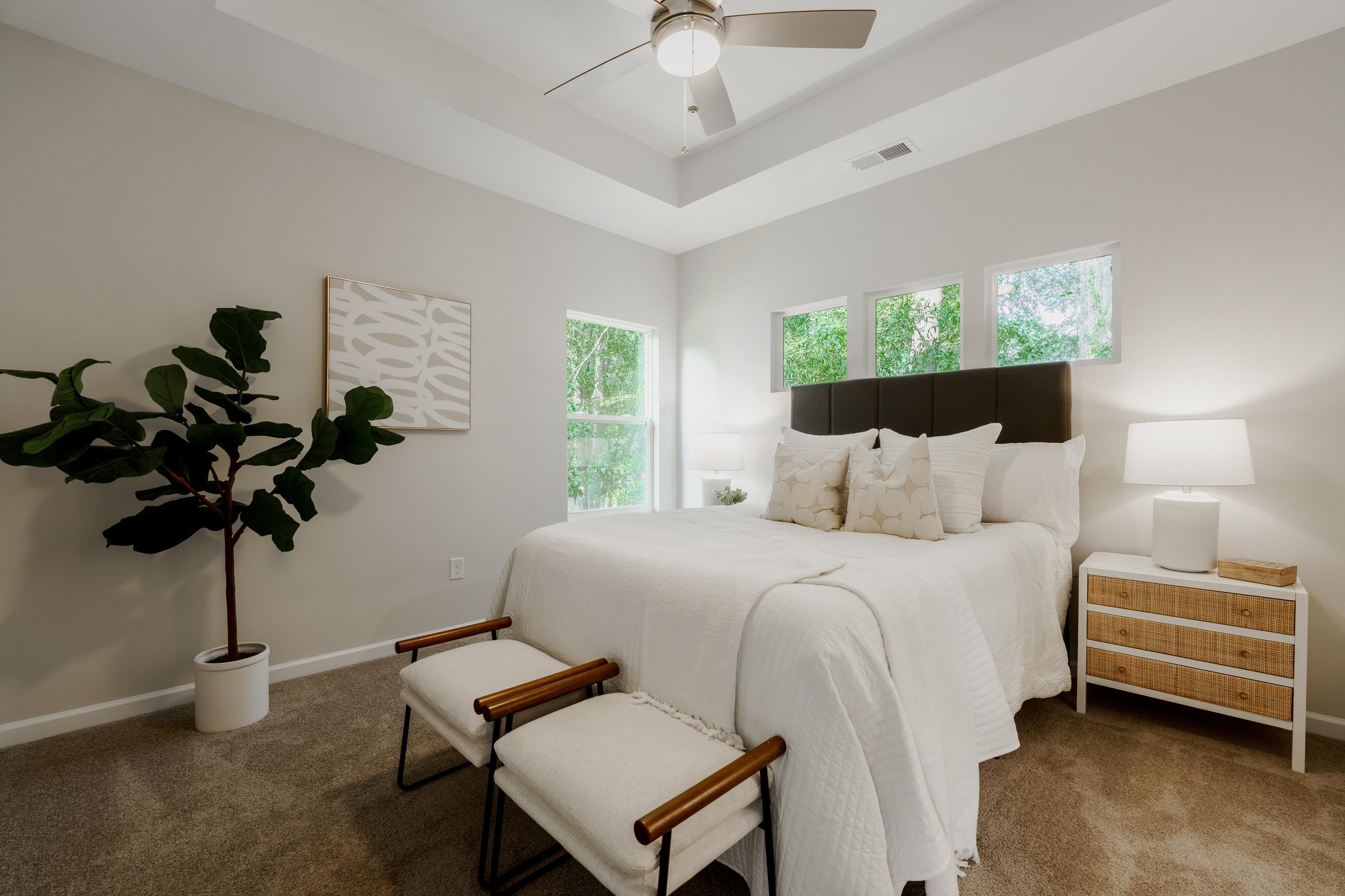 1309 Swingline Way Raleigh, NC 27610 - Photo 28 of 47 a bed room with a bed window and a chandelier