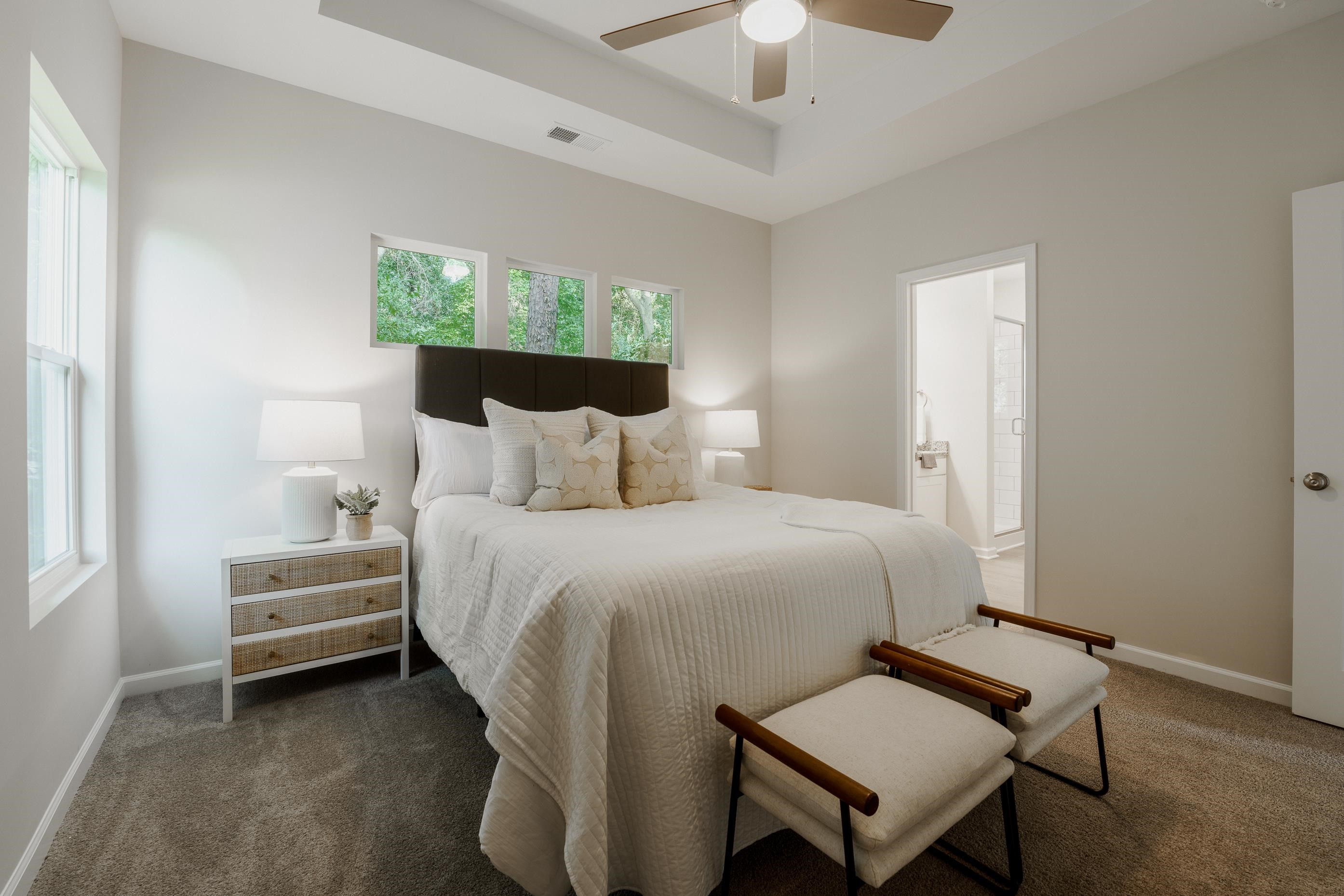 1309 Swingline Way Raleigh, NC 27610 - Photo 30 of 47 a bedroom with a bed and a potted plant