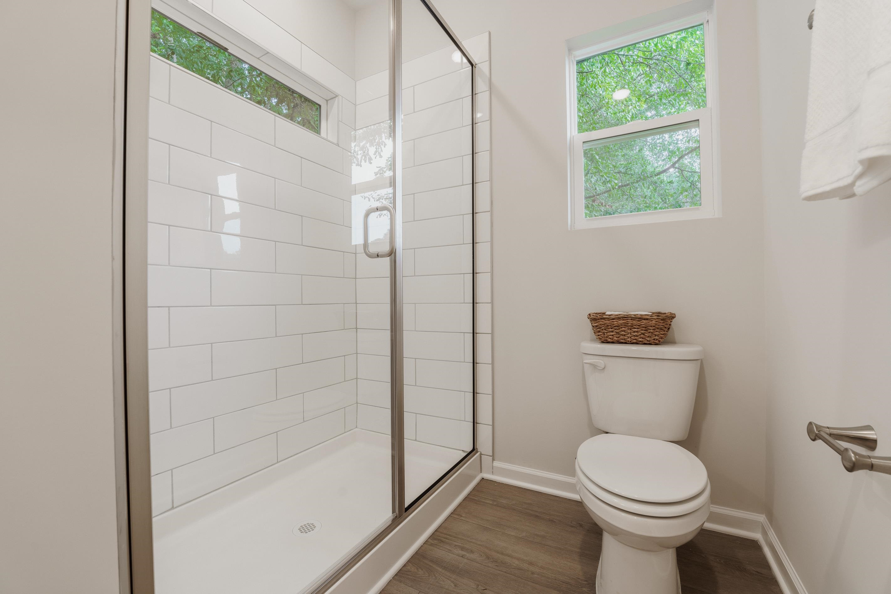 1309 Swingline Way Raleigh, NC 27610 - Photo 33 of 47 a white toilet sitting next to a shower