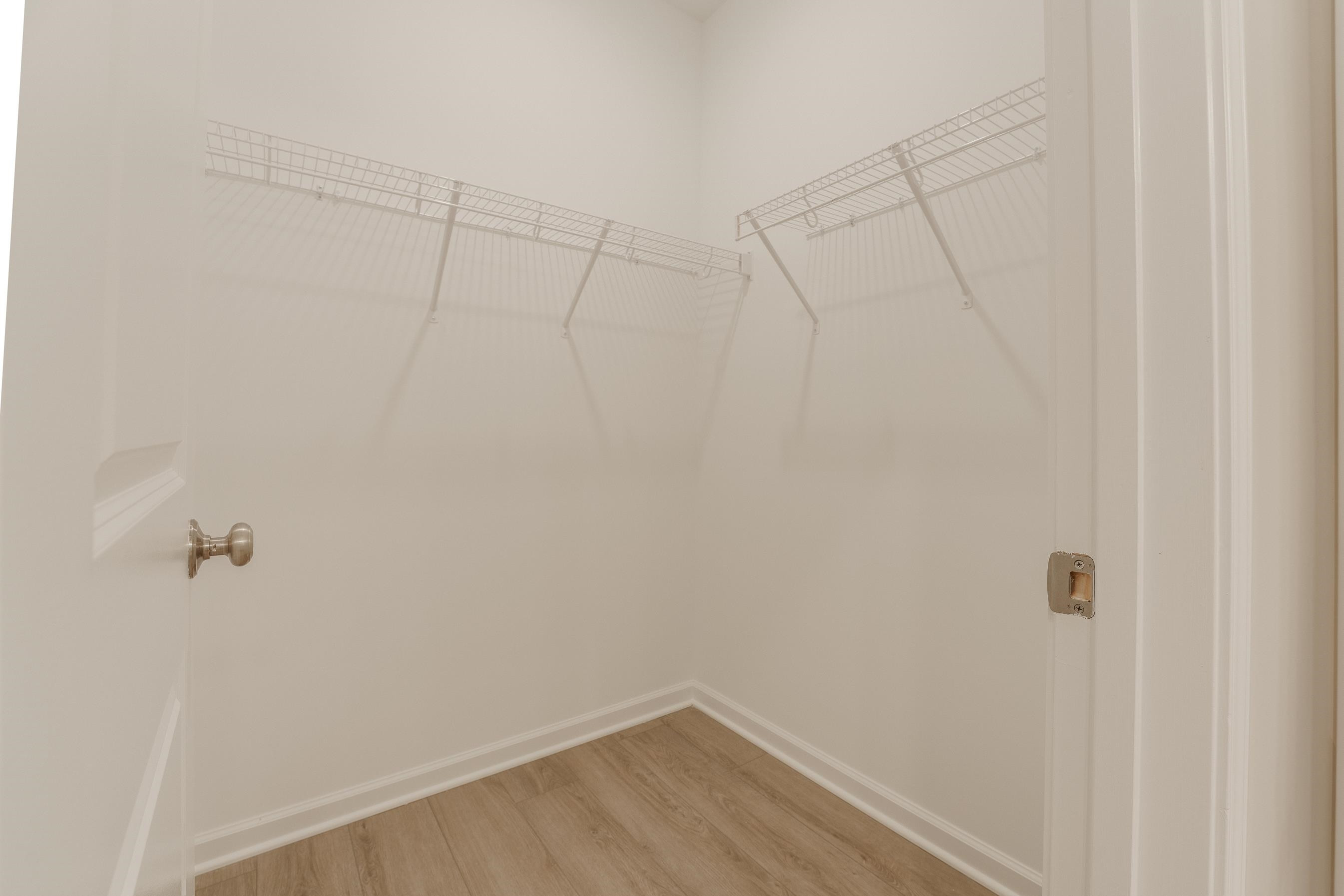 1309 Swingline Way Raleigh, NC 27610 - Photo 35 of 47 a view of a room with racks on the wall