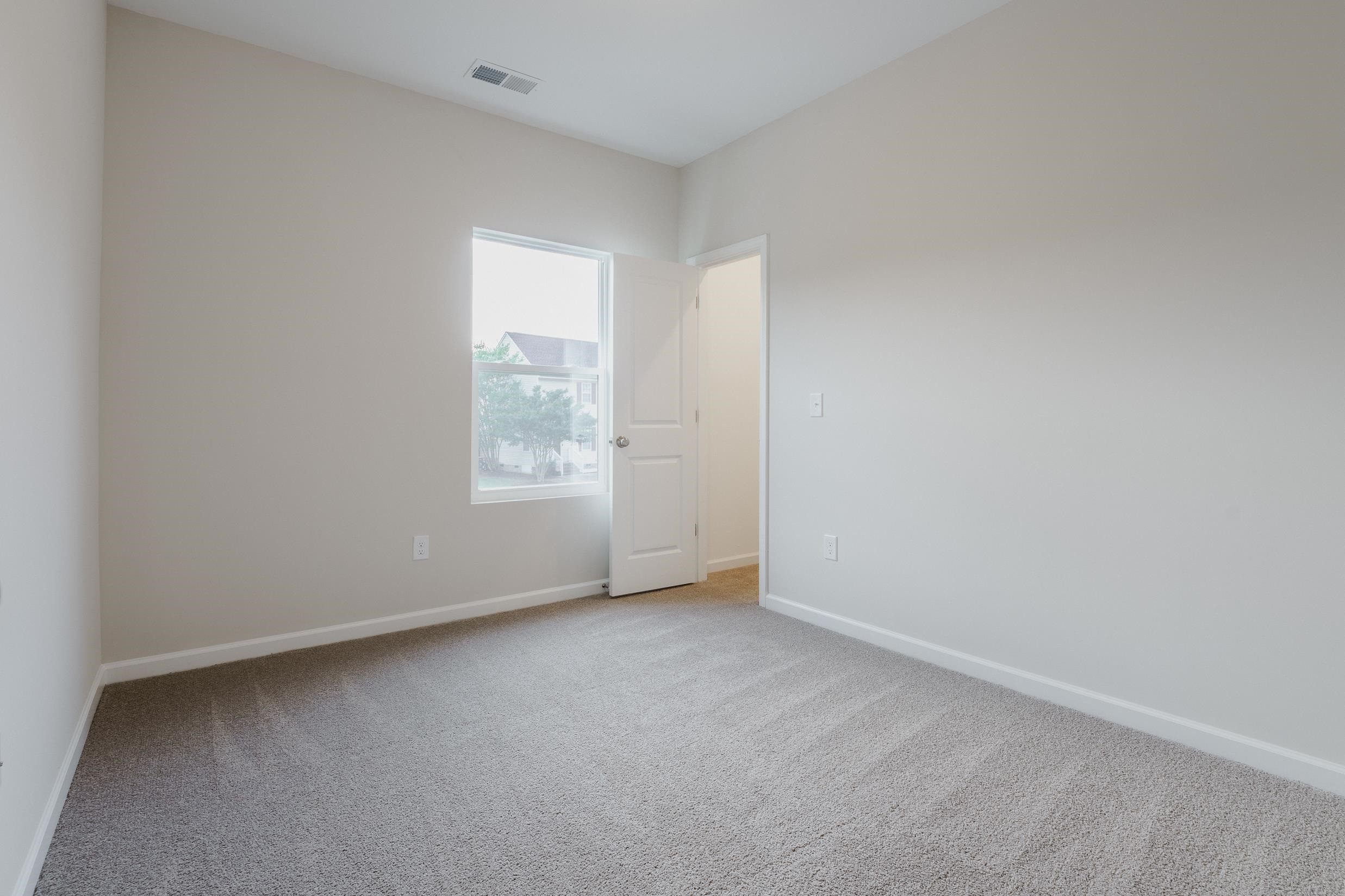 1309 Swingline Way Raleigh, NC 27610 - Photo 36 of 47 an empty room with a window