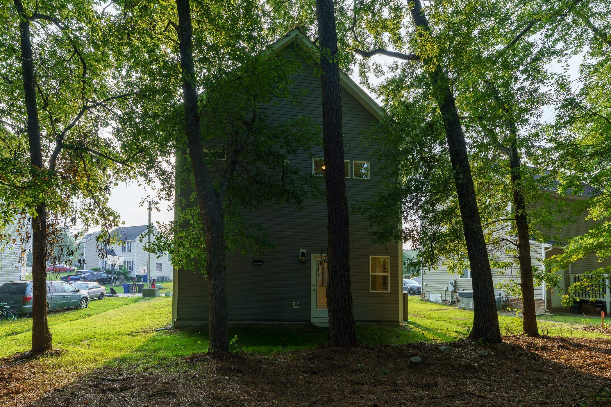 1309 Swingline Way Raleigh, NC 27610 - Photo 44 of 47 a view of a garden with trees
