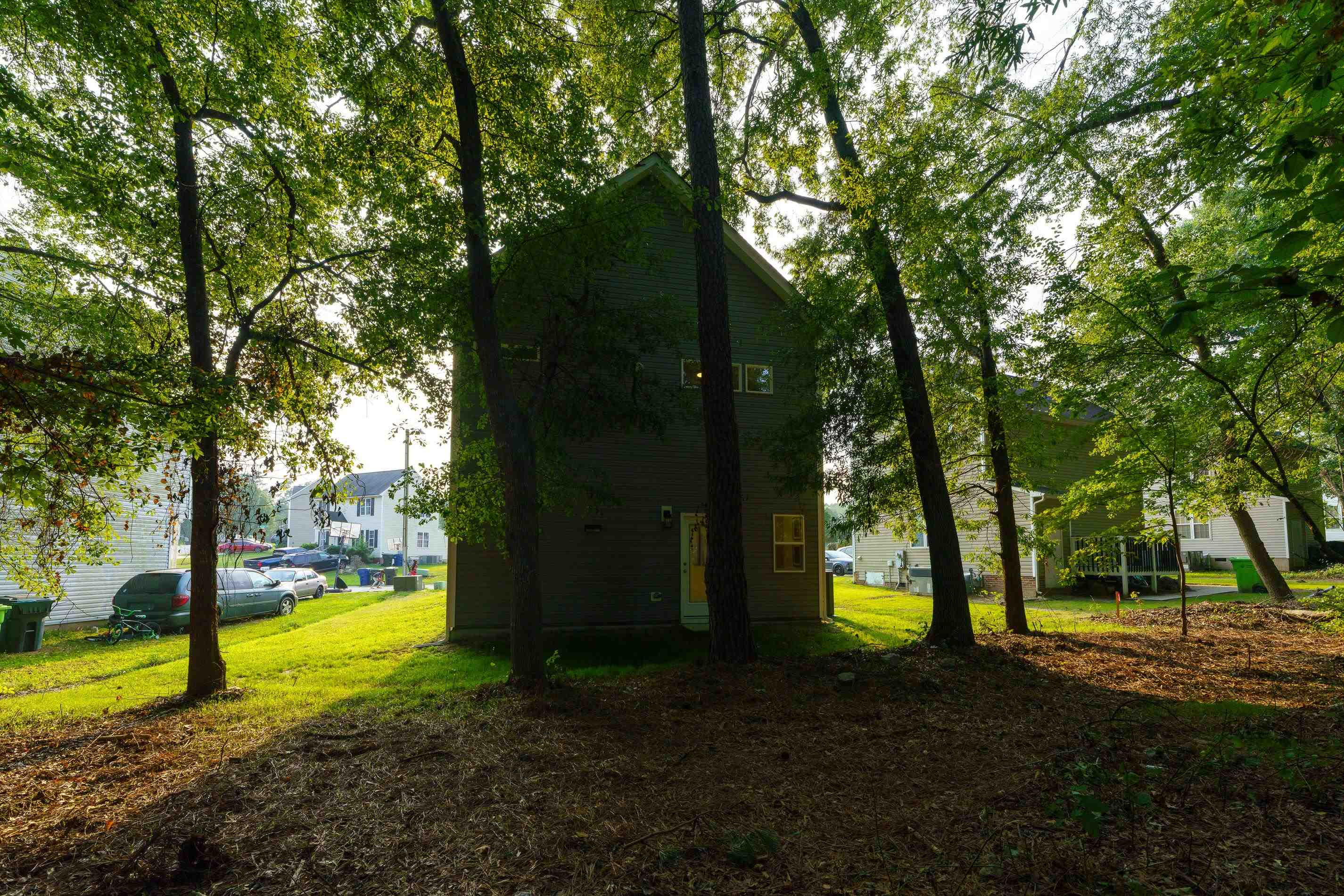 1309 Swingline Way Raleigh, NC 27610 - Photo 45 of 47 a view of a yard with palm trees and a small yard
