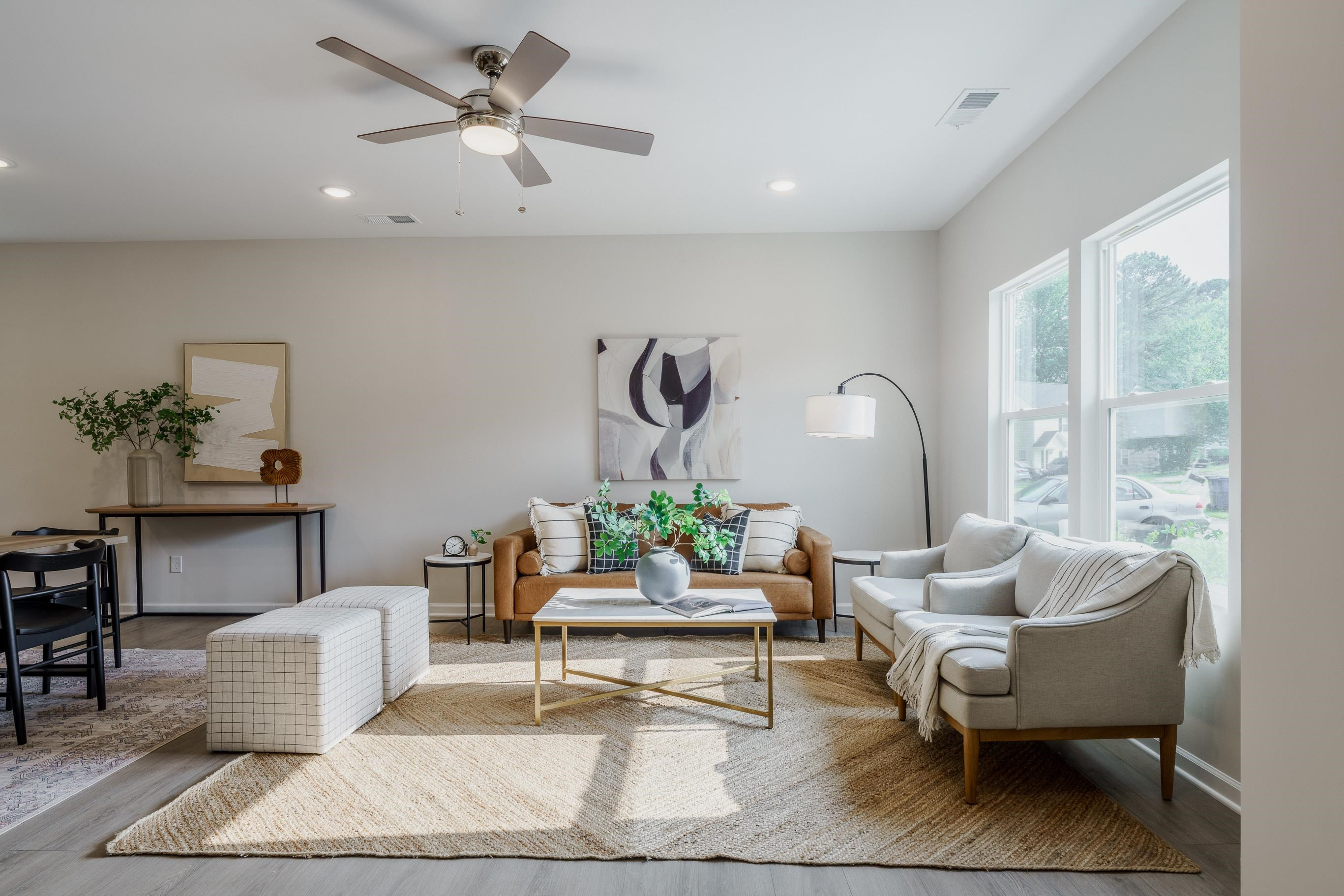 1309 Swingline Way Raleigh, NC 27610 - Photo 5 of 47 a living room with couches chairs and a potted plant