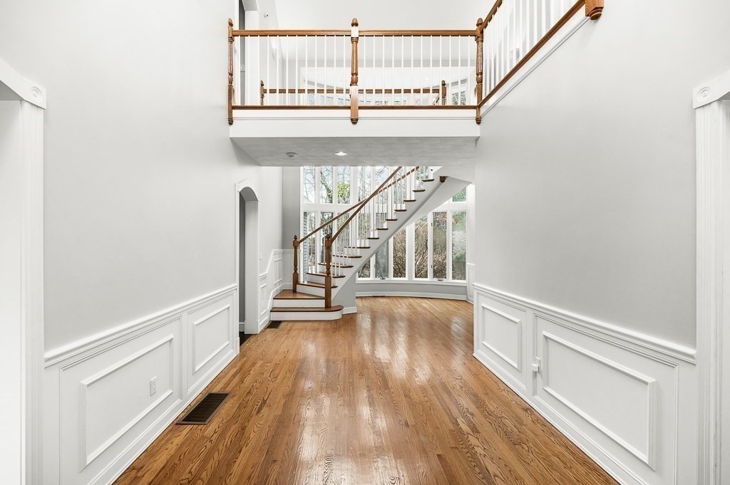 144 Grapevine Road Wenham, MA 01984 - Photo 15 of 42 a view of entryway and kitchen with wooden floor