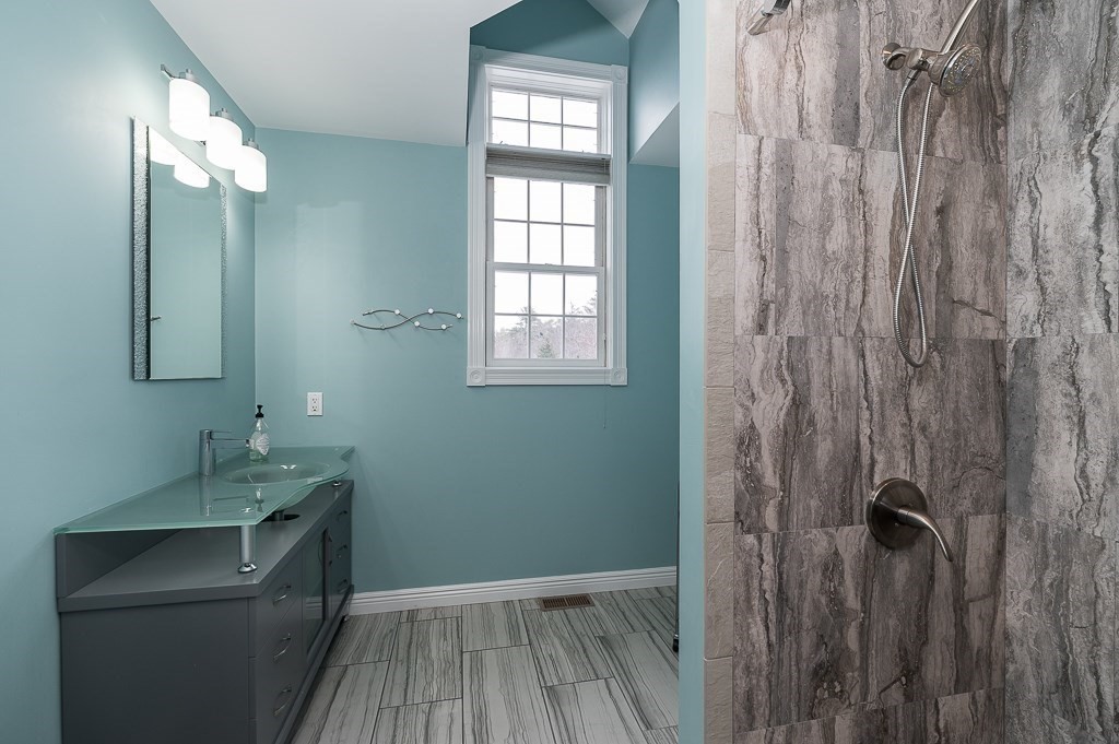 144 Grapevine Road Wenham, MA 01984 - Photo 30 of 42 a bathroom with a sink a toilet and shower