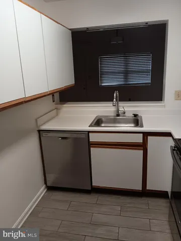 a kitchen with a sink and a microwave
