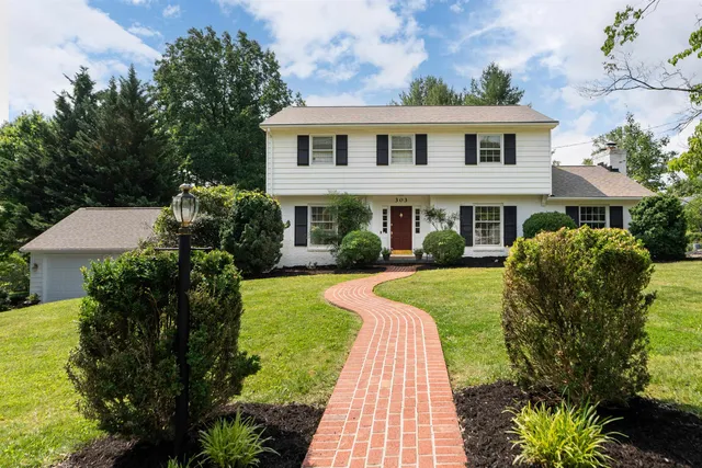 a view of dining room with a sink and chandelier