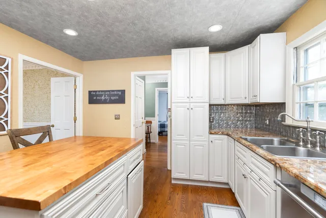 a view of staircase with black and white walls
