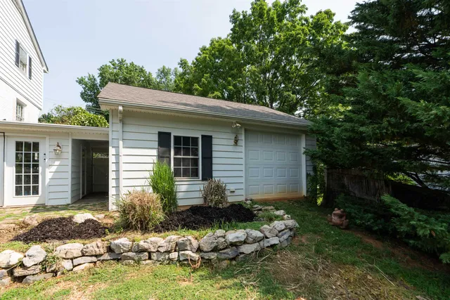 a view of a house with swimming pool and sitting area