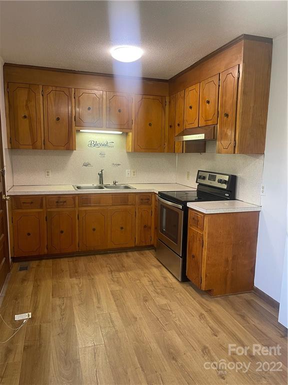 3538 Rudisill Road Newton, NC 28658 - Photo 2 of 20 a kitchen with stainless steel appliances granite countertop a sink counter space cabinets and a sink