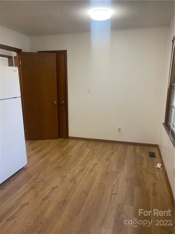 3538 Rudisill Road Newton, NC 28658 - Photo 3 of 20 a view of empty room with wooden floor