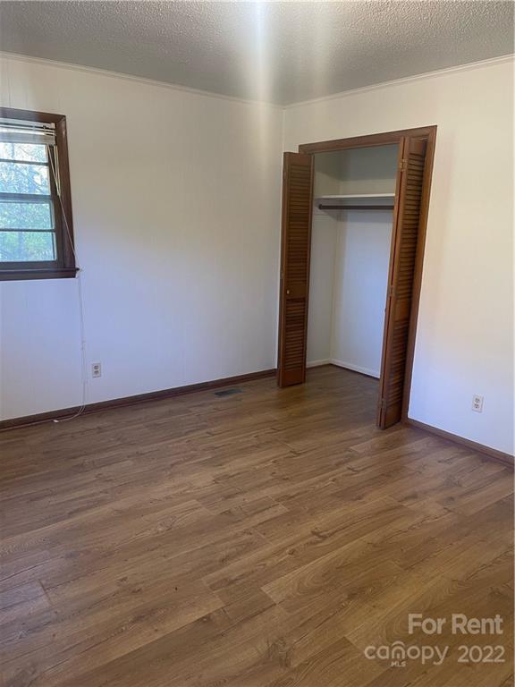 3538 Rudisill Road Newton, NC 28658 - Photo 9 of 20 a view of an empty room and wooden floor