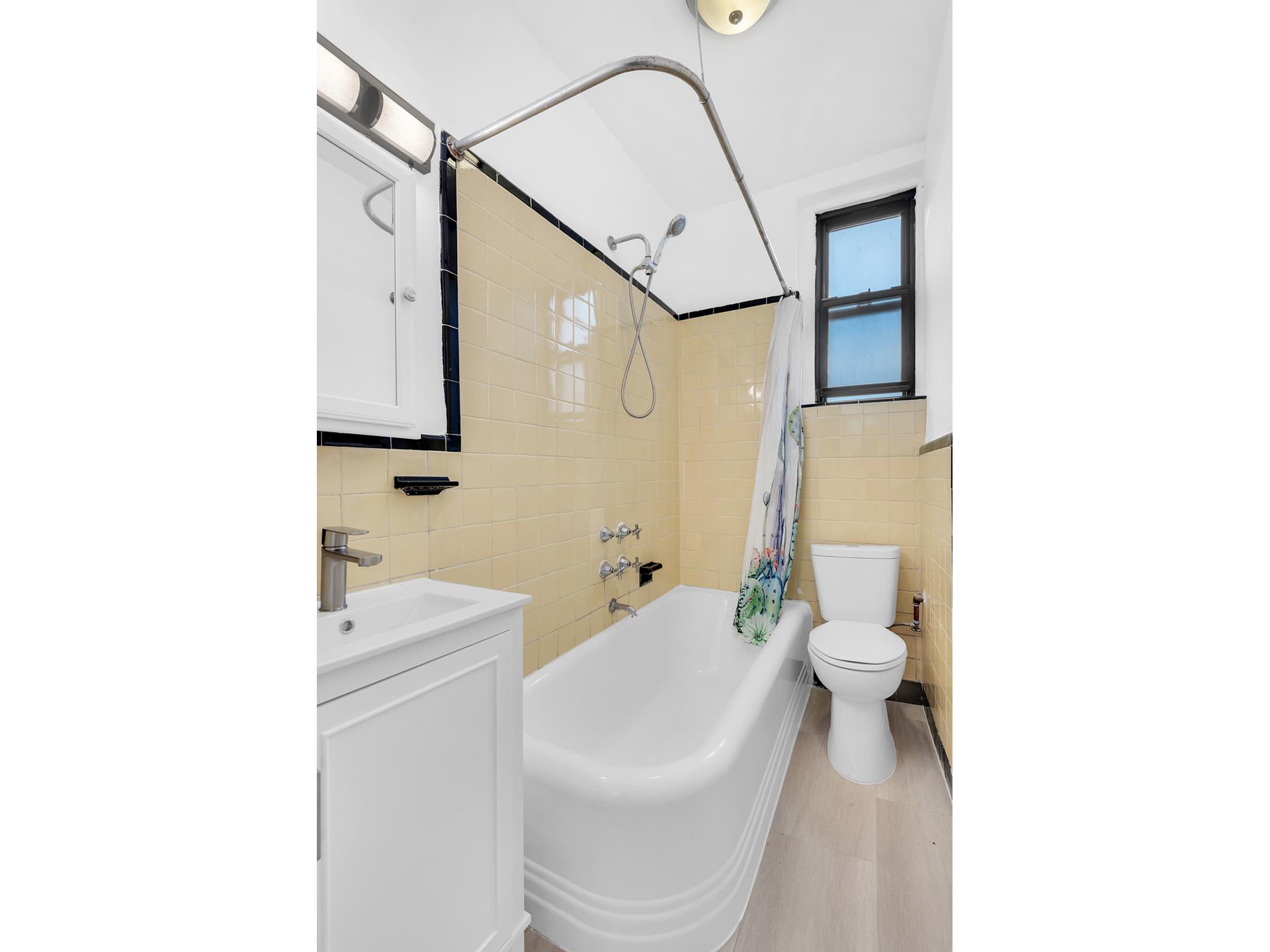 130 Bay Ridge Parkway, Unit 5K Brooklyn, NY 11209 - Photo 6 of 11 a bathroom with a toilet sink and shower