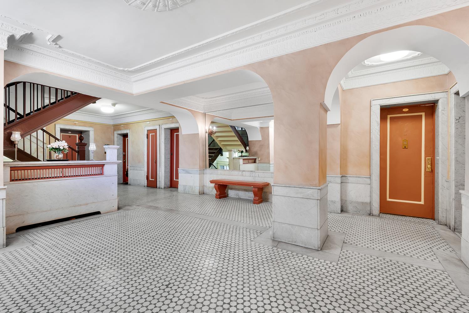 130 Bay Ridge Parkway, Unit 5K Brooklyn, NY 11209 - Photo 8 of 11 a living room with furniture and a window