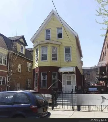 a front view of a house with parking