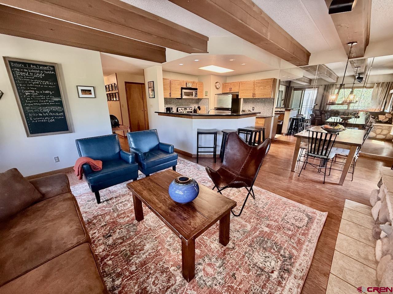 11 Snowmass Road, Unit 337 Crested Butte, CO 81225 - Photo 8 of 35 a living room with furniture and a rug