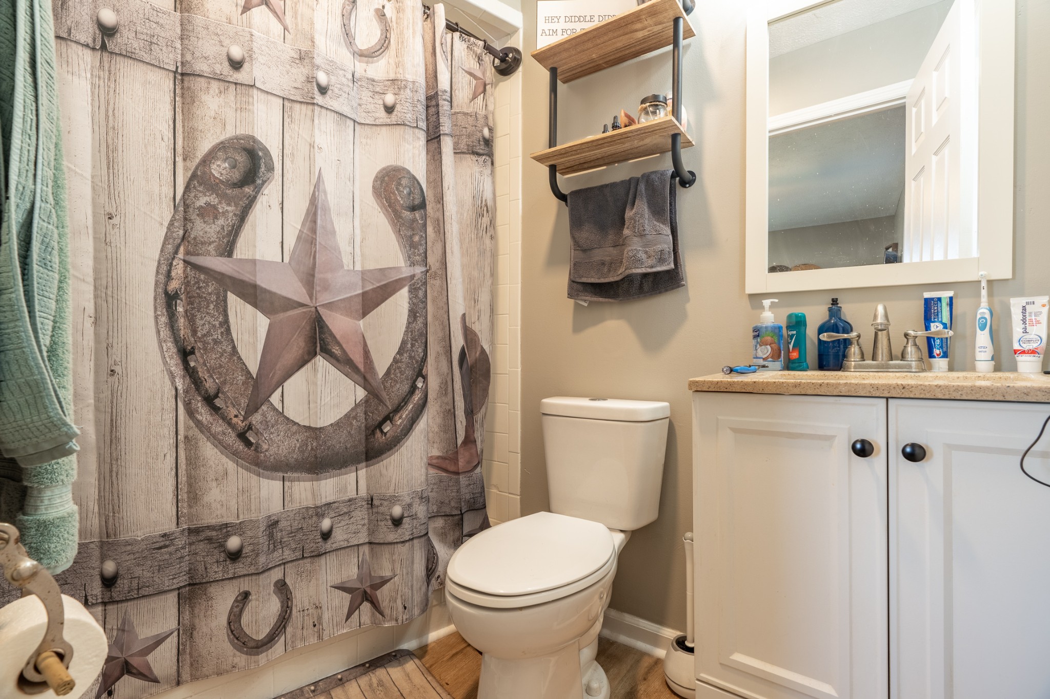 1727 Johnson Chapel Road Sparta, TN 38583 - Photo 11 of 30 a bathroom with a toilet sink and mirror