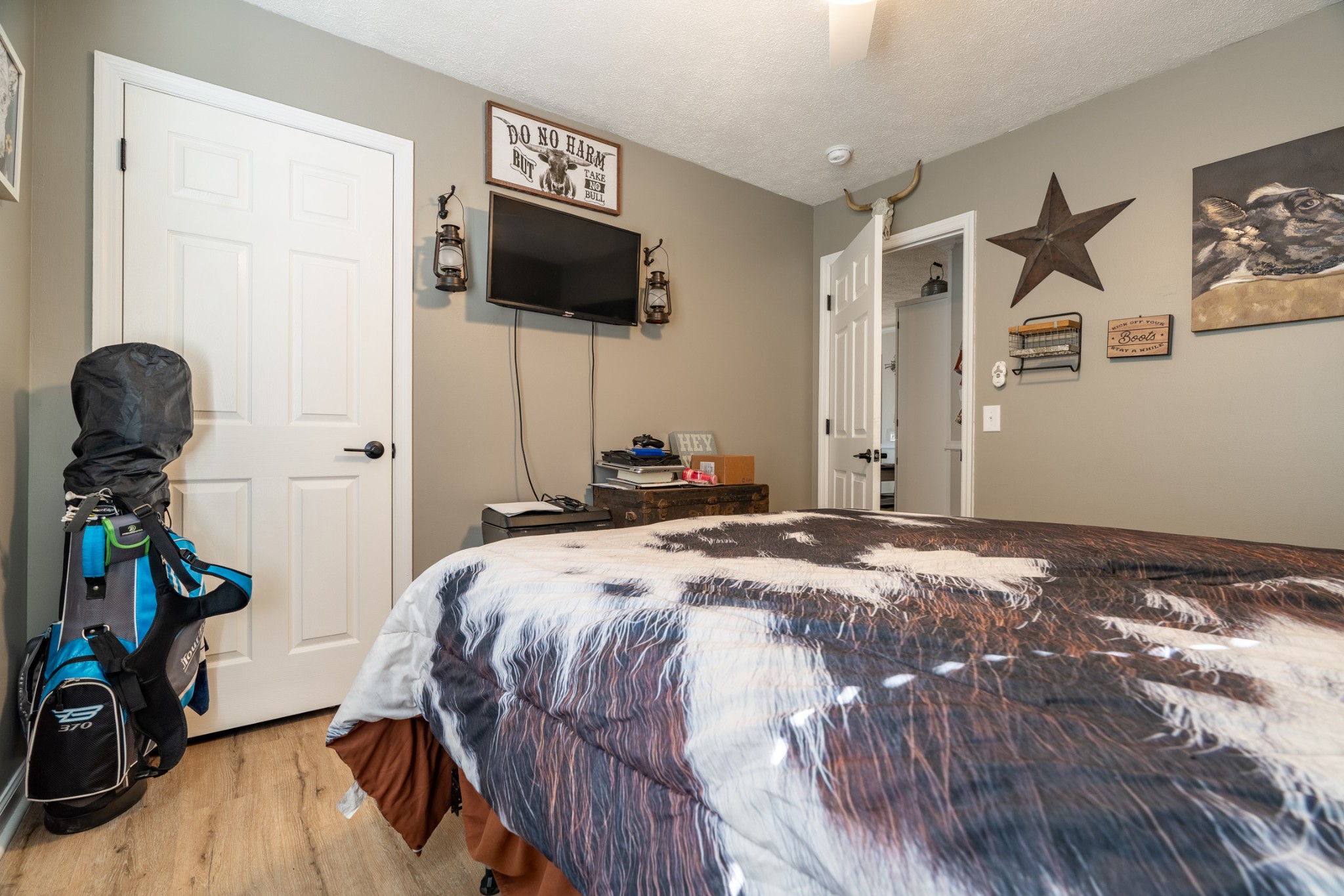1727 Johnson Chapel Road Sparta, TN 38583 - Photo 13 of 30 a bedroom with a bed and a flat tv screen on the dresser
