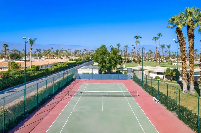 a view of a patio with chairs and tables