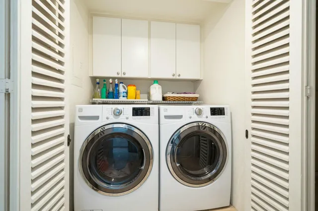 a view of a lake with a table and chairs