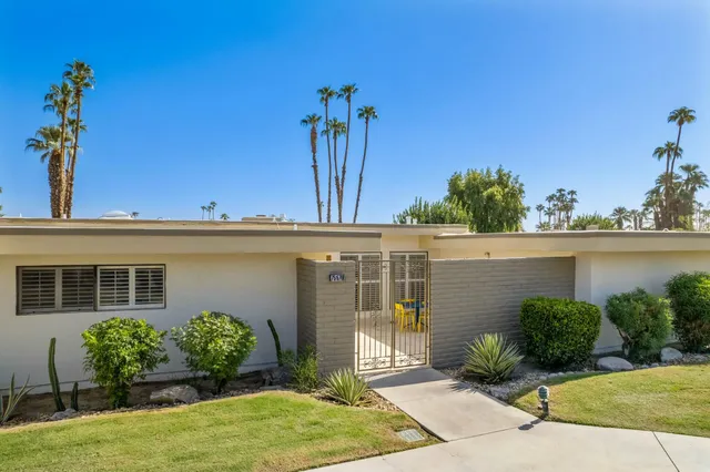 a balcony with furniture and a window