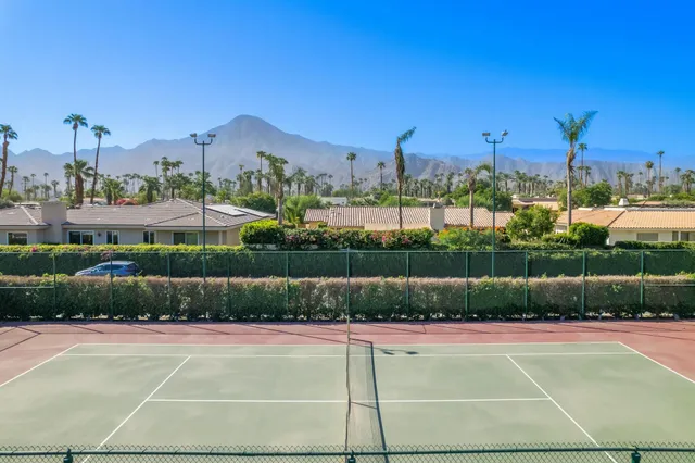 a bedroom with bed and a window