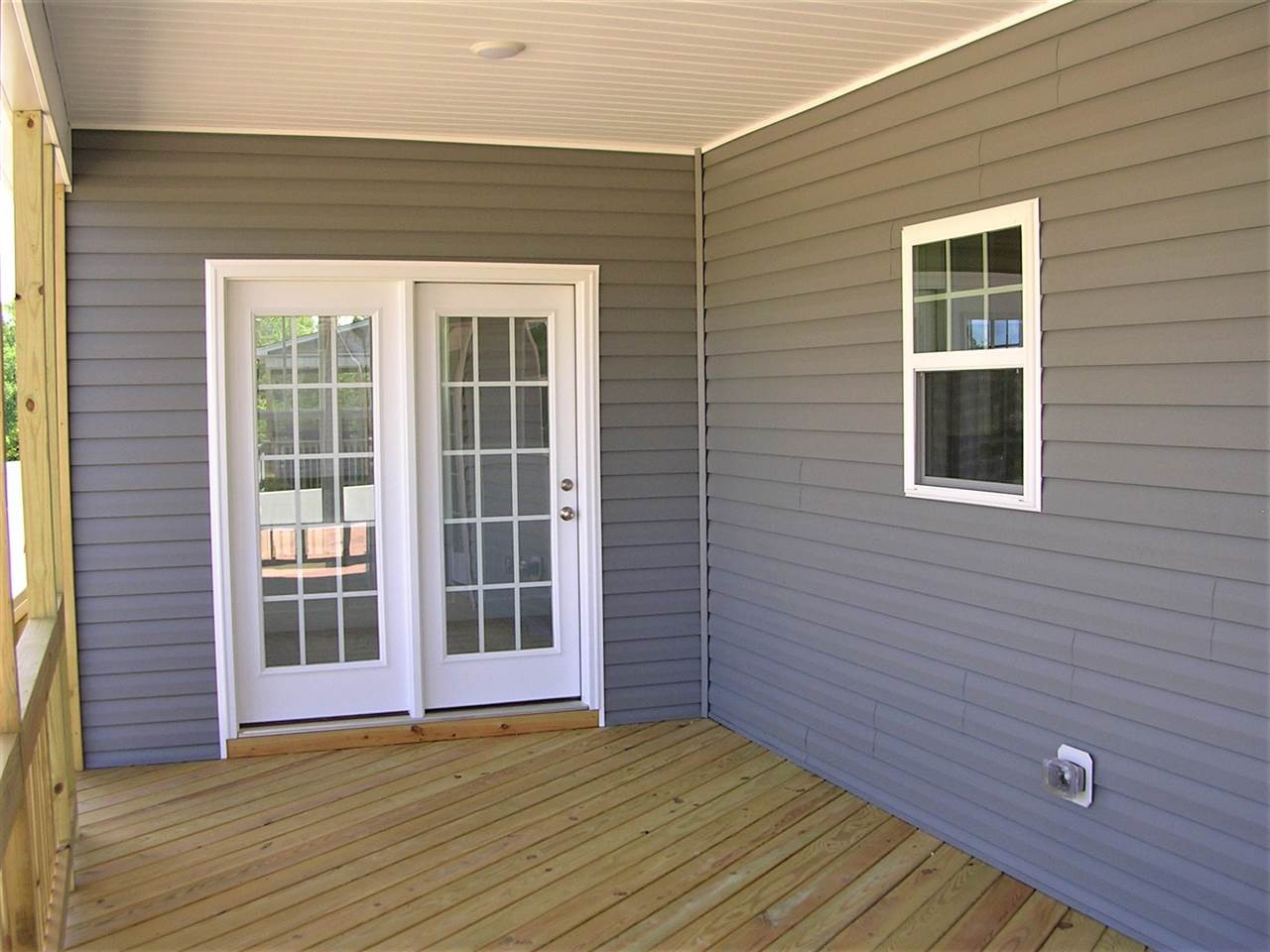 2791 Jack Road, Unit LT 4 Clayton, NC 27520 - Photo 11 of 13 Screening Available; Representative Photo; Colors and Features May Vary Covered Rear Porch w/entrance from Master Bedroom