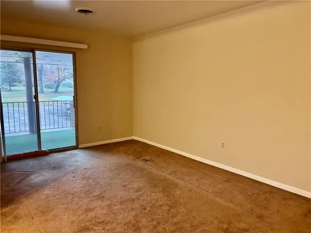 an empty room with sliding door