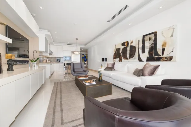 a large kitchen with a table and chairs