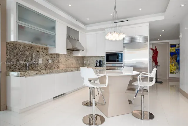 a view of a hallway with wooden floor and glass door