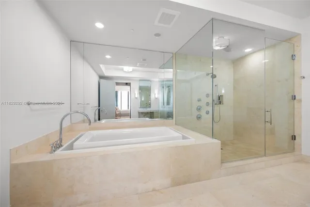 a bathroom with a tub and shower