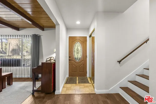 a view of entryway with wooden floor