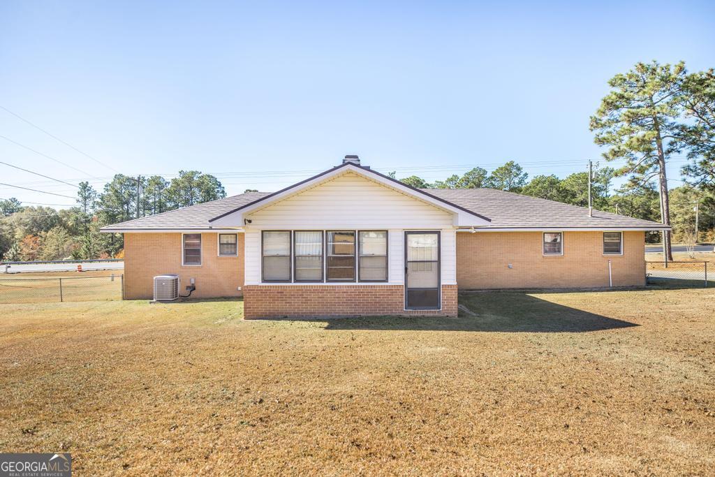 172 Old Eastman Road Cochran, GA 31014 - Photo 11 of 60 a front view of a house with a yard
