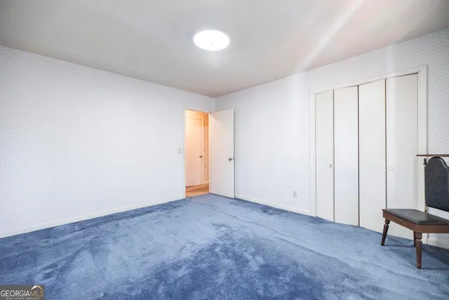 a living room with furniture and a ceiling fan