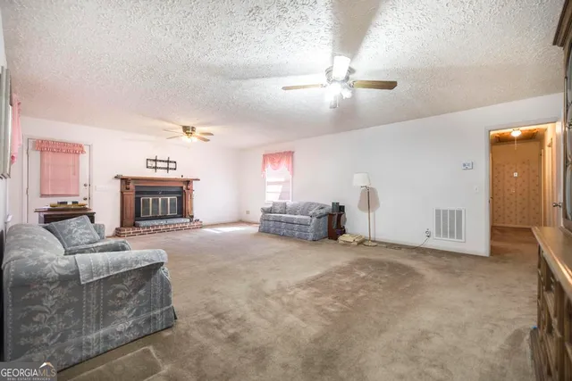a view of a dining room with furniture and window