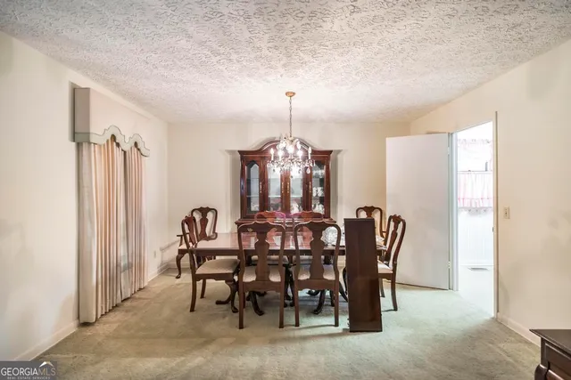 a kitchen with a sink a stove and cabinets