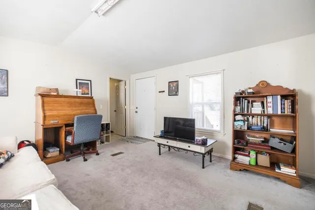 a room with gym equipment and a large window