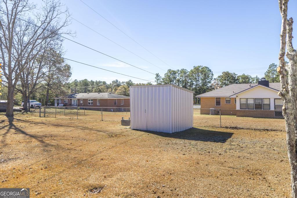 172 Old Eastman Road Cochran, GA 31014 - Photo 46 of 60 a view of a house with a yard