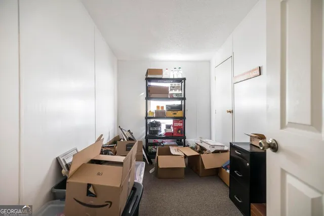 a kitchen with appliances a sink and a window