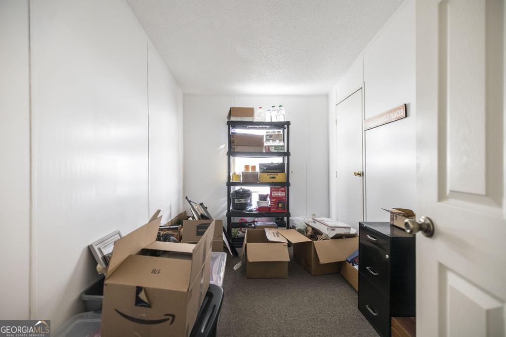 172 Old Eastman Road Cochran, GA 31014 - Photo 49 of 60 a room with gym equipment and a large window
