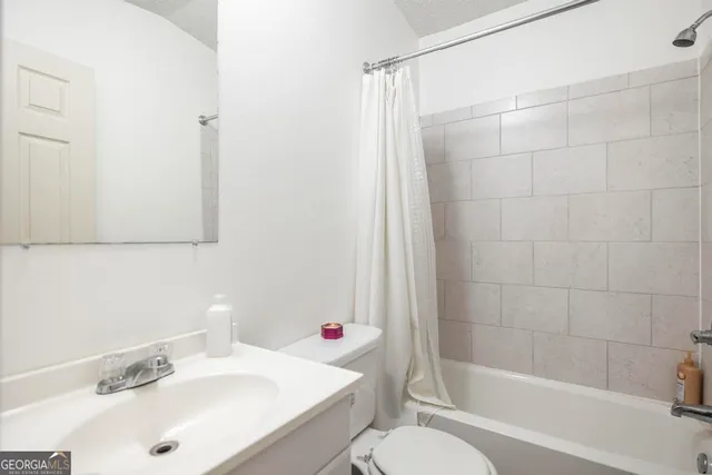 a view of a house with a snow in the yard