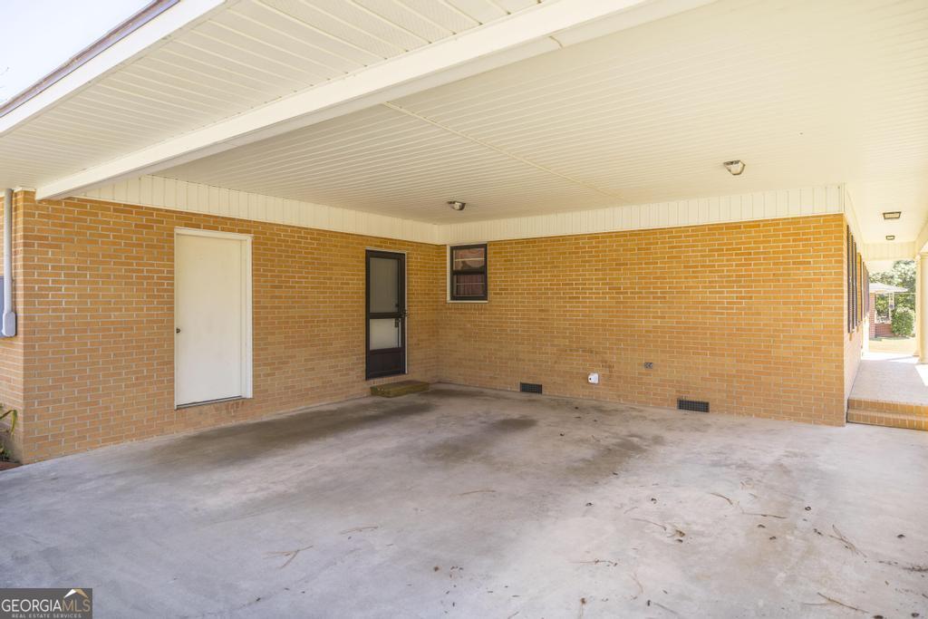 172 Old Eastman Road Cochran, GA 31014 - Photo 5 of 60 a view of an empty room with a window