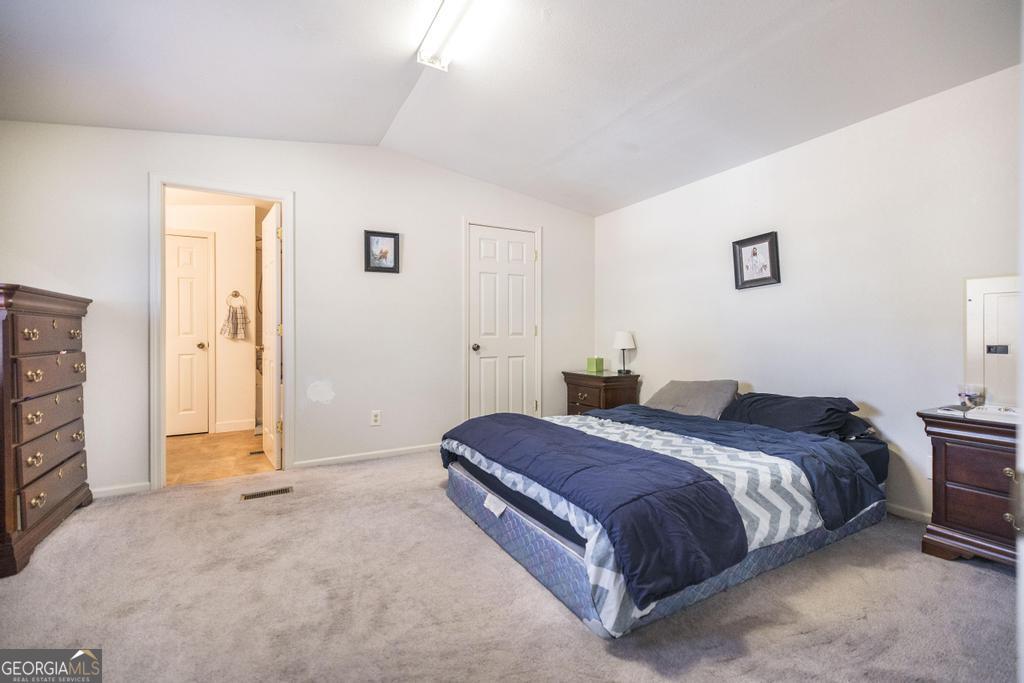 172 Old Eastman Road Cochran, GA 31014 - Photo 56 of 60 a bedroom with a bed and a closet
