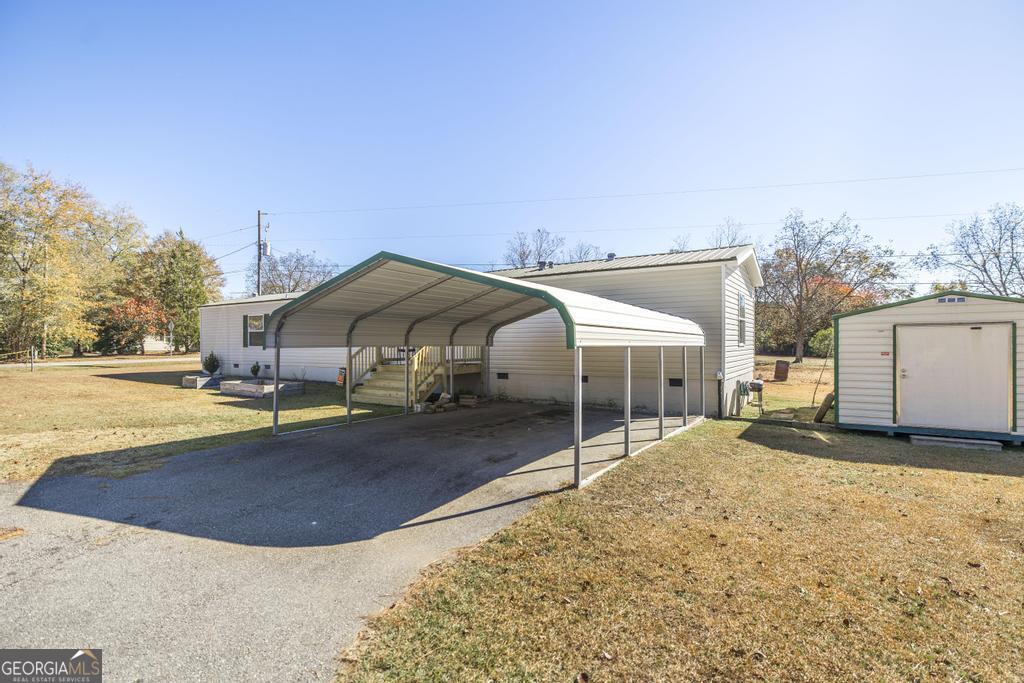 172 Old Eastman Road Cochran, GA 31014 - Photo 60 of 60 a view of a house with a snow in the yard