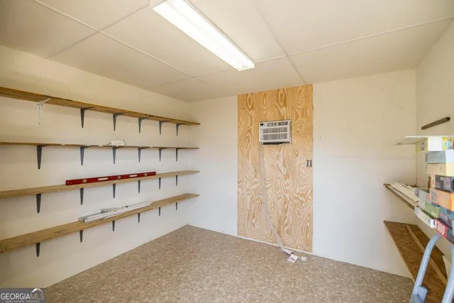 a view of a house with a yard and garage