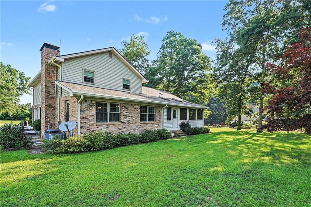 740 Smyrna Road Southwest Conyers, GA 30094 - Photo 24 of 27 a front view of house with yard and green space
