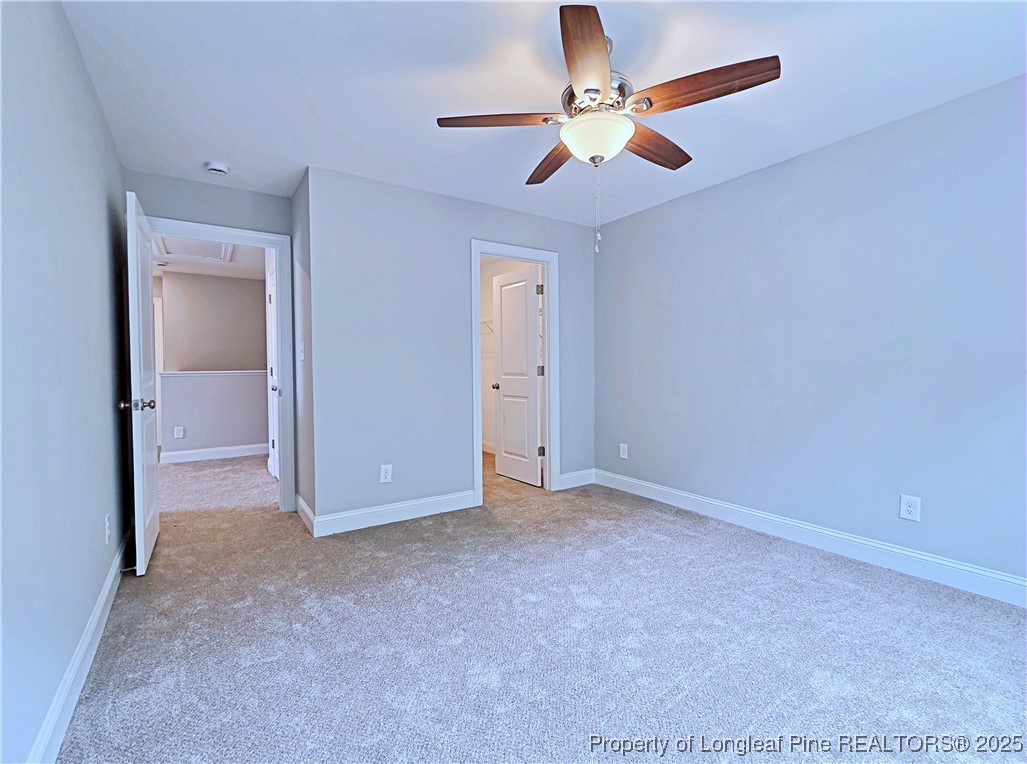 940 Kensington Park Road Fayetteville, NC 28311 - Photo 24 of 41 an empty room with closet and a chandelier fan